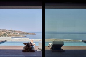 A heated pool, sun loungers