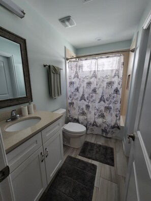 Combined shower/tub, hair dryer, towels, soap