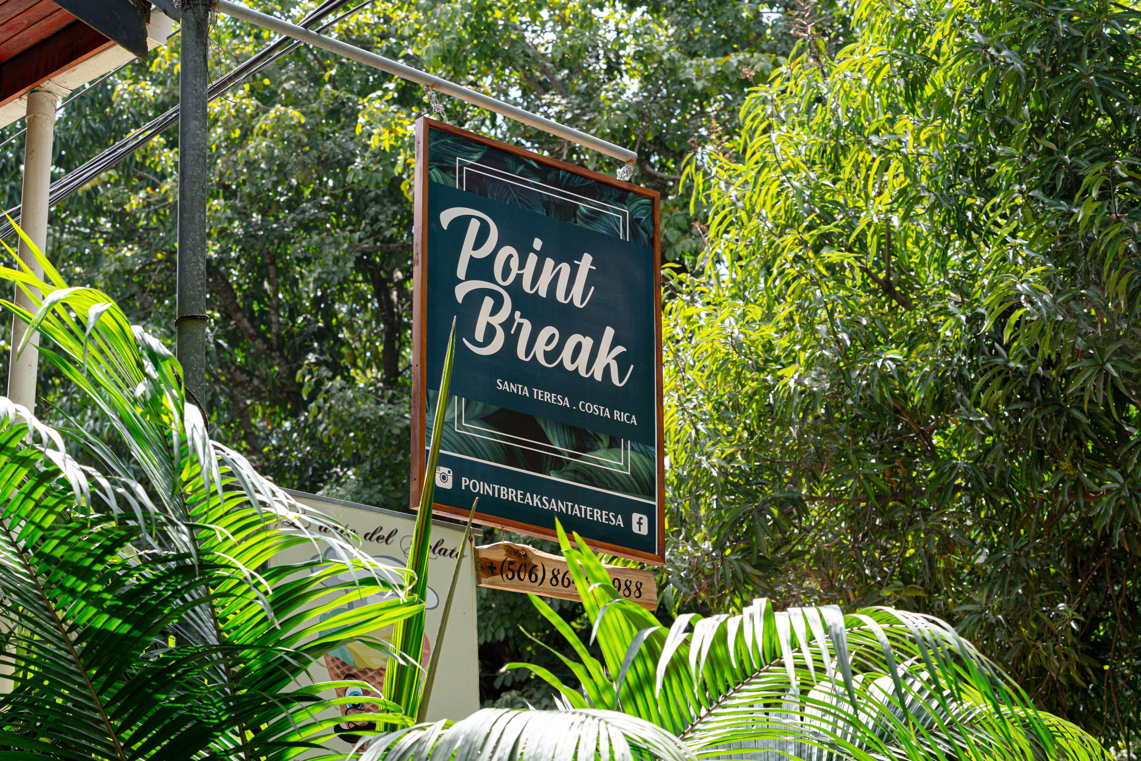 A sign for 'Point Break' in Santa Teresa, Costa Rica, with a contact number.