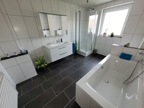 Bathtub, hair dryer, towels