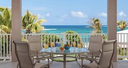 Hibiscus Beach House! 2 bedroom, 2.5 bath, take 30 steps to your private beach
