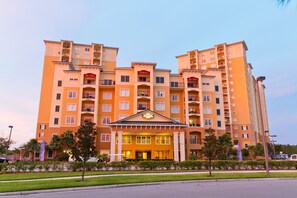 Stunning hotel building with a central entrance and beautifully manicured grounds.