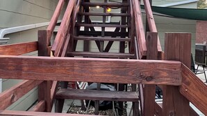 A wooden staircase leading to a building with a green roof. - Bristol Short Stay for work, Nascar,Music, 1bdrm King size, Queen sleeper sofa.  (Bristol)