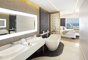 Bathtub, rainfall showerhead, hair dryer, slippers