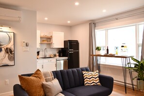 City Room | Living area | 55-inch Smart TV with digital channels, fireplace - Jardin Suites Highfield (Moncton)