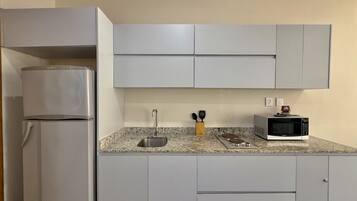 Fridge, coffee/tea maker, cookware/dishes/utensils