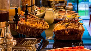 A buffet setup with various food items and kitchen equipment. - Batesta Hotel (Tbilisi)
