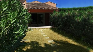 A house with a tiled roof, a paved entrance, and a well-maintained lawn. - 10 MNS from PORTO VECCHIO MINI VILLA WITH SEASIDE LAND MER-6 People (Saint Lucie de Porto Vecchio)