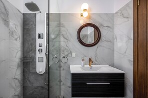 Shower, hair dryer, towels, soap