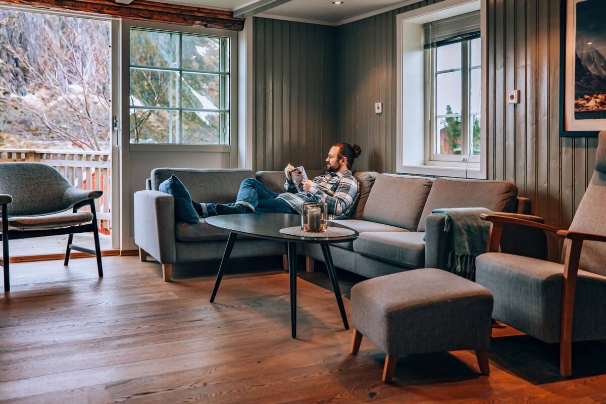 A cozy living room with a sofa, armchair, and coffee table.