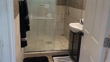 Shower, towels, soap, toilet paper
