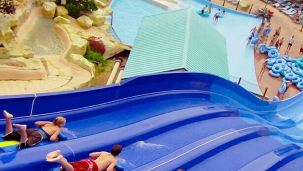 A water park with multiple slides and a pool area. - Hot Tub, Lake Views, Mins to SDC, Pools-Sleeps 16 (Branson)