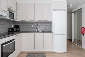 Exclusive Apartment | Private kitchen | Fridge, microwave, oven, stovetop