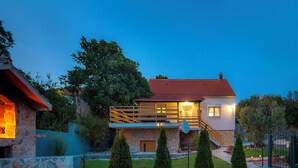 A modern two-story house with a stone facade, a red-tiled roof, and a satellite dish. - House Manda Adriatic (Piramatovci)