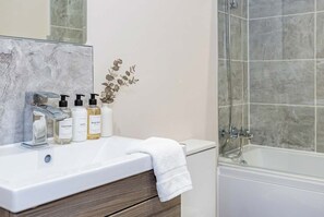 Bathtub, free toiletries, hair dryer, towels