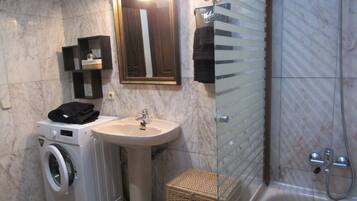 Bathtub, bidet, soap, toilet paper