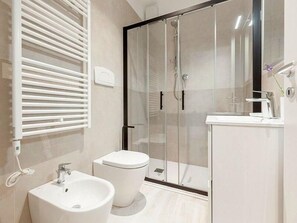 Shower, free toiletries, hair dryer, slippers