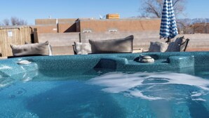 A hot tub with a clear view of the sky and buildings in the background. - Heated Pool and Hot Tub -Casa Bonita An Irvie Home (Albuquerque)