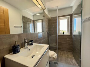 Bathtub, hair dryer, towels