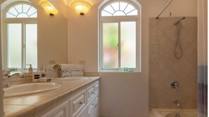 Combined shower/tub, hair dryer, towels, soap