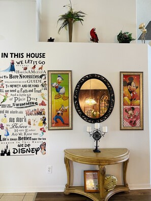 Immerse yourself in a Disney-themed retreat with Disney posters and a nostalgic atmosphere.
