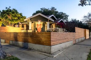 Stylish single-story home with a charming front porch and bench.