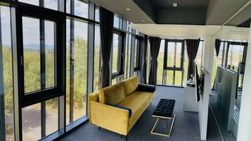 Panoramic Studio Suite, City View | Minibar, in-room safe, desk, laptop workspace