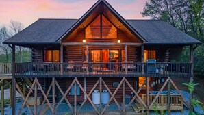 A log cabin with a balcony, a fireplace, and a deck. - Lake Lure Family Escape | Sleeps 10 | Bunk Room | Hot Tub | Near Chimney Rock (Lake Lure)