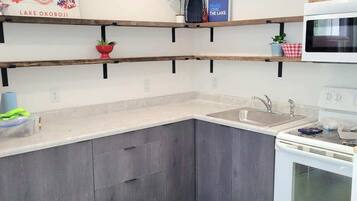 There is a full kitchen in this 1400 square foot suite at the top of Stay Suites. There is a balcony for all the suites to use down one level.