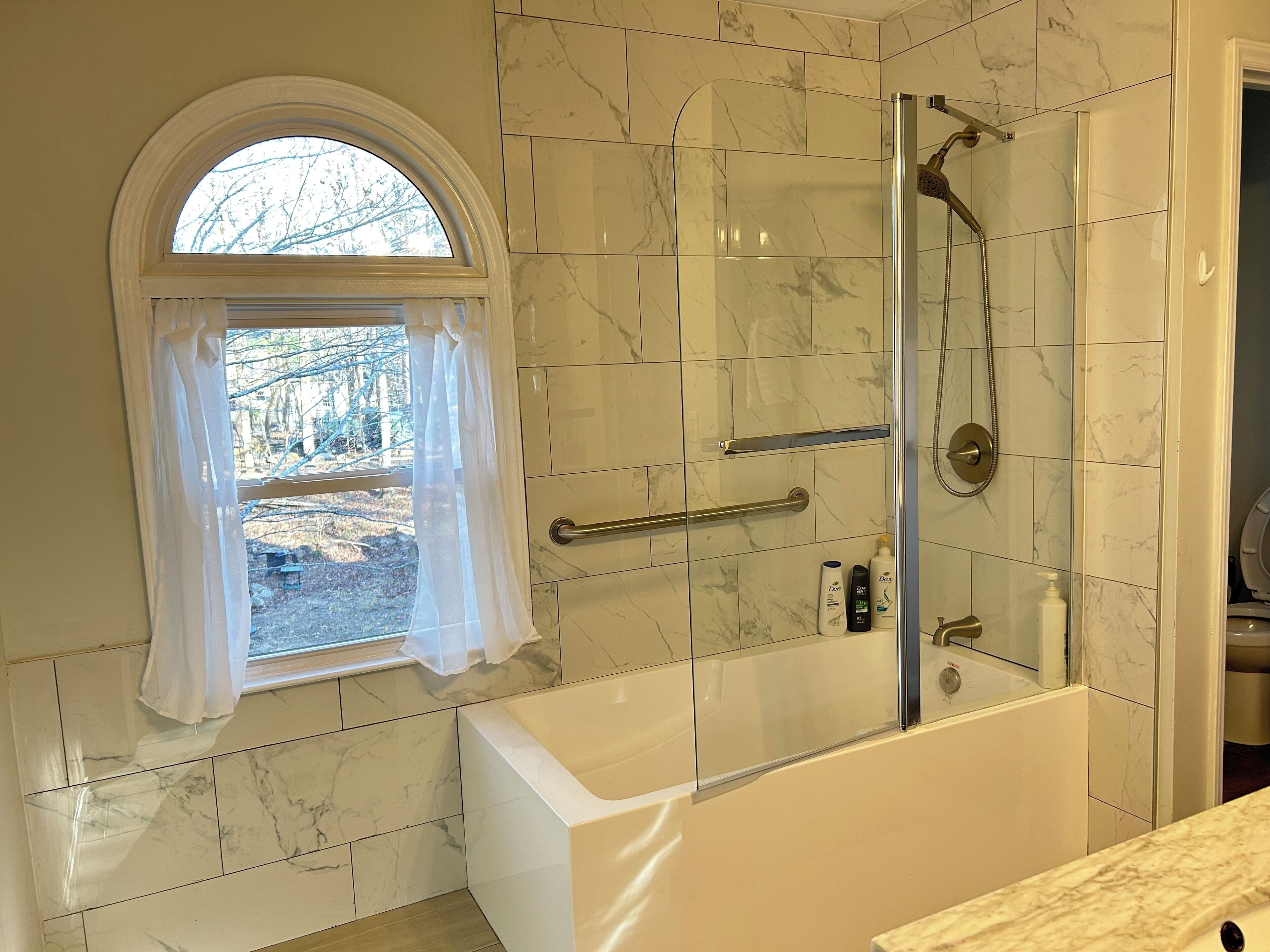 Combined shower/tub, hair dryer, towels, soap