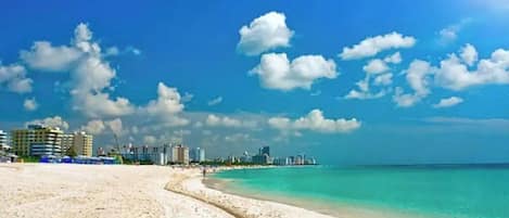 On the beach, sun-loungers, beach towels