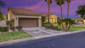 A residential house with a garage, palm trees, and a well-maintained lawn. - Feel yourself at home !!! (Indio)