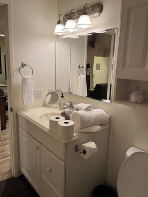 Combined shower/bathtub, hair dryer, towels, soap