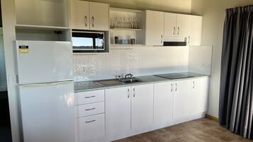 Family Cabin | Private kitchen | Fridge, microwave, stovetop, electric kettle