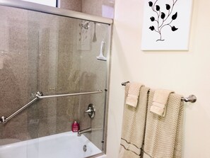 Combined shower/tub, hair dryer, towels, soap