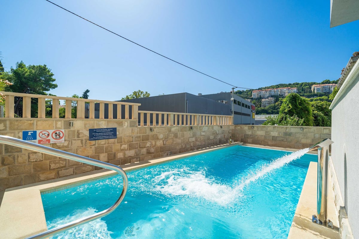 Seasonal outdoor pool, pool umbrellas, pool loungers
