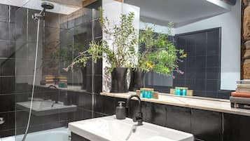 Bathtub, hair dryer, towels, soap