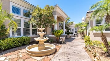 Stroll through this tranquil courtyard, surrounded by lush greenery and a soothing fountain.
