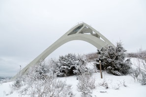 A large, white, arched bridge structure amidst a snowy landscape with sparse vegetation. - Apartment - Im Hohlen Seifen 10-h Winterberg (Winterberg)