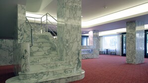 A marble staircase with a handrail, leading to a second floor. - ALEXANDRIA Spa & Wellness hotel (Luhacovice)