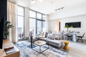 Premium Apartment, 2 Bedrooms, Non Smoking, Pool View | Living room | 55-inch Smart TV with cable channels, TV, streaming services - EDEN'S Homes & Villas - Millennium Atria Residences (Dubai)