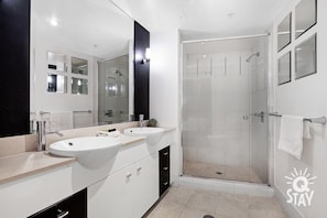 Bathtub, hair dryer, towels, soap