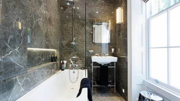 Bathtub, hair dryer, towels