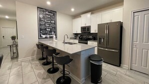 Microwave, oven, stovetop, dishwasher - Rent the Perfect 5 Bedroom Townhome on Champions Gate Resort, Orlando Townhome 5788 (Davenport)