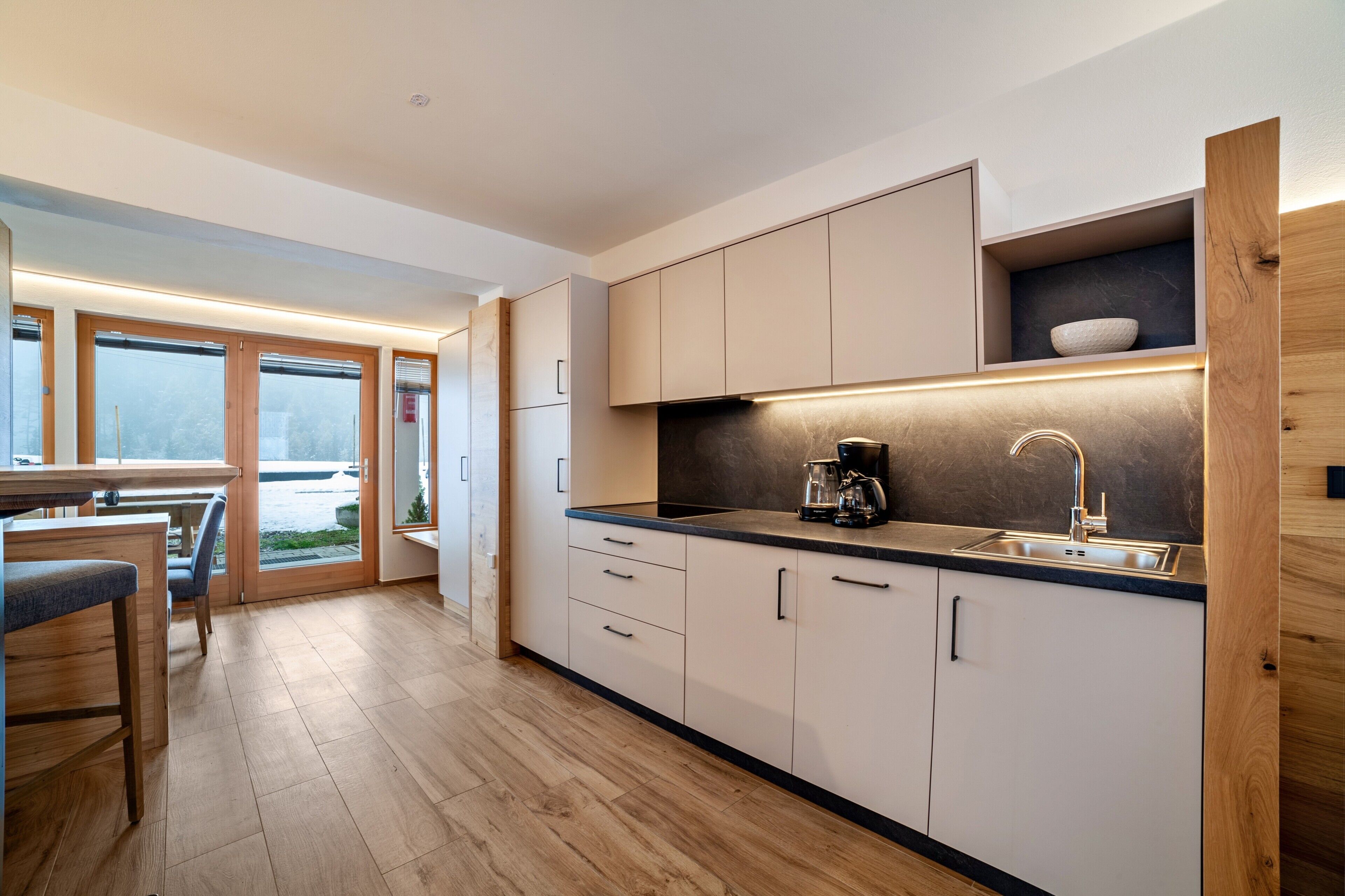 Fridge, stovetop, dishwasher, coffee/tea maker