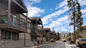 A multi-story hotel with balconies, stone facade, and a mountain backdrop. - Ski-In/Ski-Out from this Condo with Shared Hot Tub & Sauna Acces (Breckenridge)