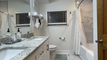 Combined shower/tub, rainfall showerhead, hair dryer, towels
