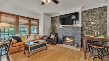 Smart TV, fireplace, table football, books