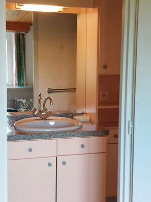 Shower, hair dryer, towels, toilet paper