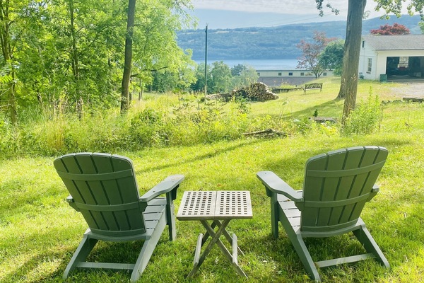 Outside sitting area with fire pit and a view of the lake